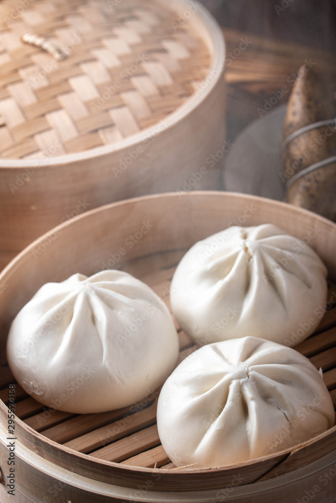 chinese steamed bun in traditional bamboo steamer