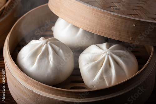 chinese steamed bun in traditional bamboo steamer