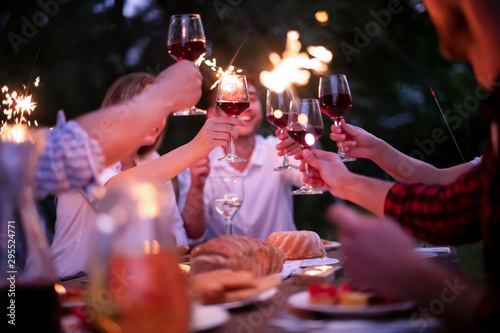 Sticker happy friends having french dinner party outdoor