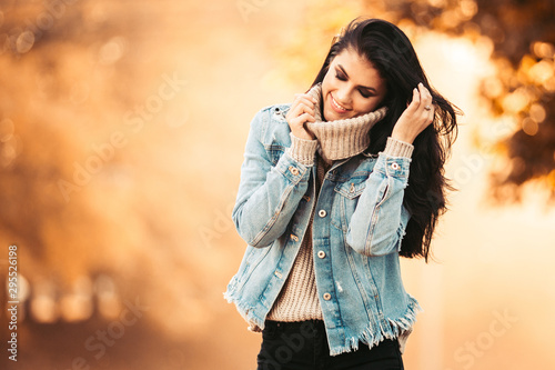 Beautiful model posing for the camera in the park.