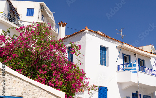 Typical white walls and blue windows of Greek Mediterranean buildings.