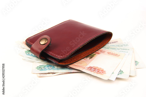 Brown leather wallet - money, banknotes on a white background. The concept of work at home. Unemployment
