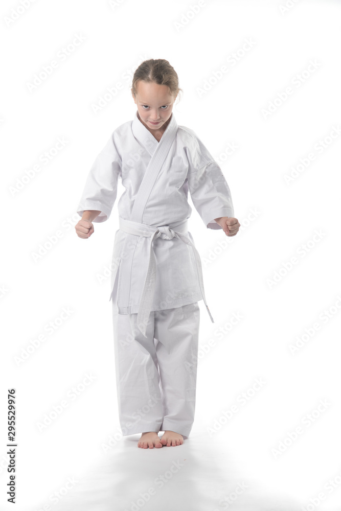 the child is engaged in karate. Stretching baby. Raise your leg high.