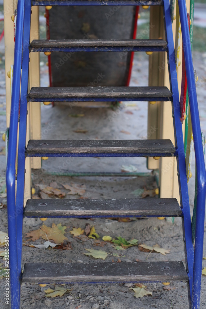 blue stairs in the playground in autumn blue stairs in the playground in autumn