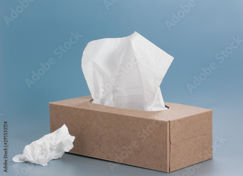paper tissue box on blue background photo