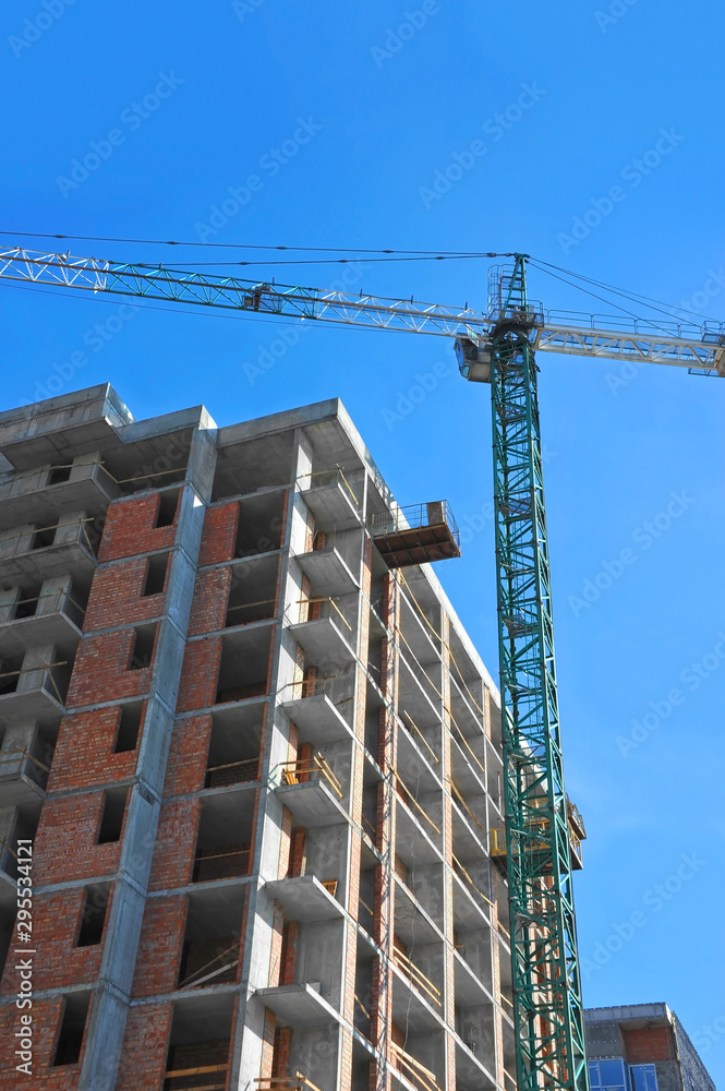 Crane and highrise construction site Crane and highrise construction site