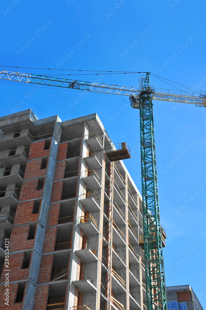 Crane and highrise construction site