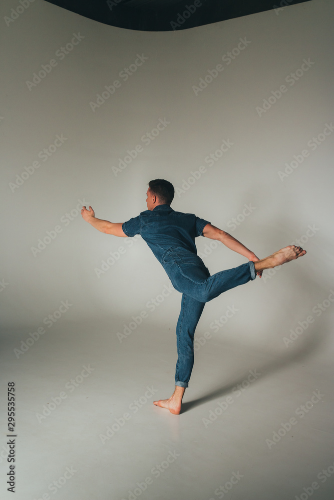 shot of mad, crazy, cheerful, successful, lucky guy in casual outfit, jeans, jumping with hands up,triumphant, gesturing against white background