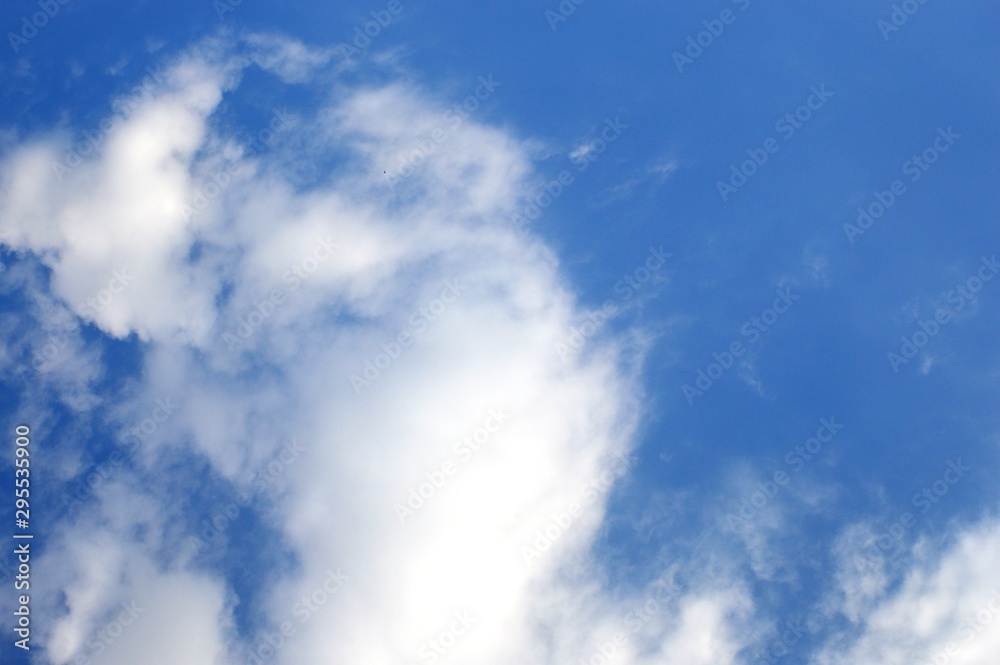  white clouds against a blue sky