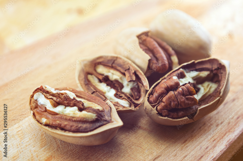 Fototapeta premium pecan close-up macro high resolution on wooden background