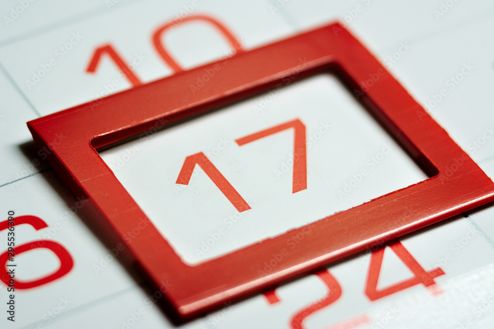 seventeenth of the month highlighted on the calendar with a red frame close-up macro, mark on the calendar, seventeenth date seventeenth of the month highlighted on the calendar with a red frame close-up macro, mark on the calendar, seventeenth date