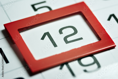 the twelfth day of the month highlighted on the calendar with a red frame close-up macro, the mark on the calendar, the twelfth date