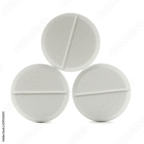 white round close-up pills macro isolated on white background