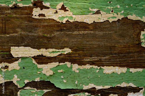 Texture of an old, damaged paintwork on wood. The texture of the old wood.