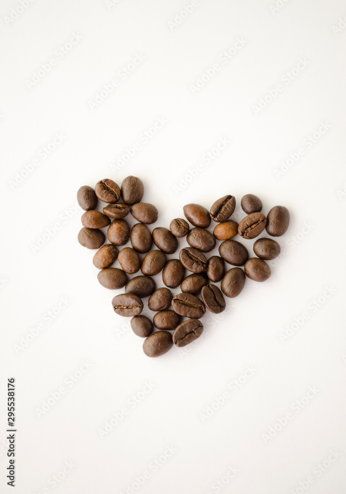 Coffee beans isolated on the white background, heart shape. I love coffee. Arabica and robusta. Coffee beans isolated on the white background, heart shape. I love coffee. Arabica and robusta.