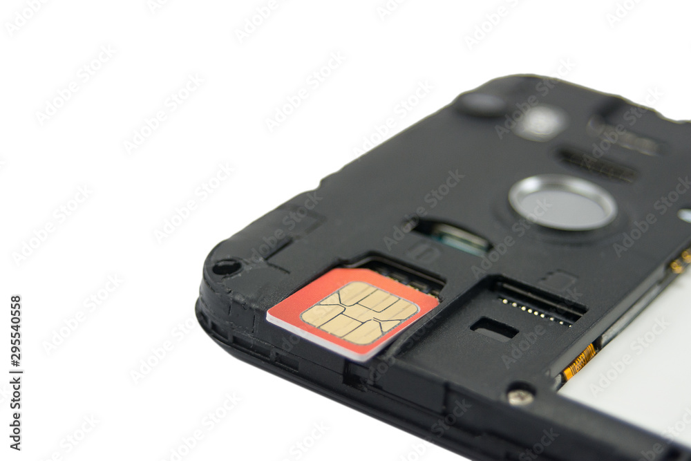 SIM card close-up next to the connector in the smartphone, phone isolated on white background SIM card close-up next to the connector in the smartphone, phone isolated on white background