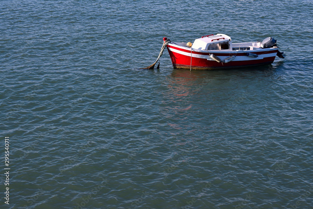 Fishing boats next to the Constitution Bridge, called La Pepa, on the coast of the capital city of Cádiz. Andalusia. Spain. Europe. August 12, 2019 Fishing boats next to the Constitution Bridge, called La Pepa, on the coast of the capital city of Cádiz. Andalusia. Spain. Europe. August 12, 2019