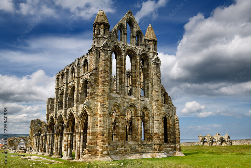 Gothic ruins of 13th Century Whitby Abbey church and Abbey House on the North Sea Whitby North York Moors National Park England