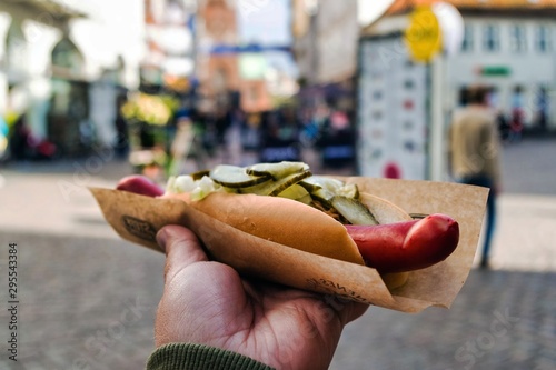 Woman Holding a Hot Dog