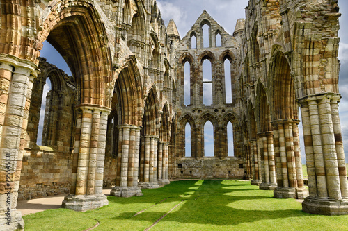 Принти на полотні Chancel and wall of the Sanctuary of Gothic ruins of Whitby Abbey church in suns