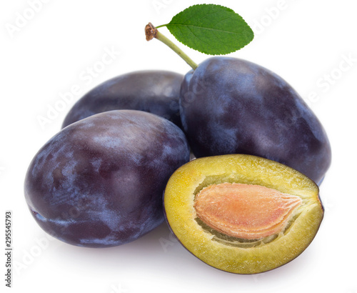 Fresh plums on white background