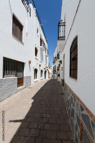 Mojacar, Spain - Narrow Street with White Buildings © ptnphotof