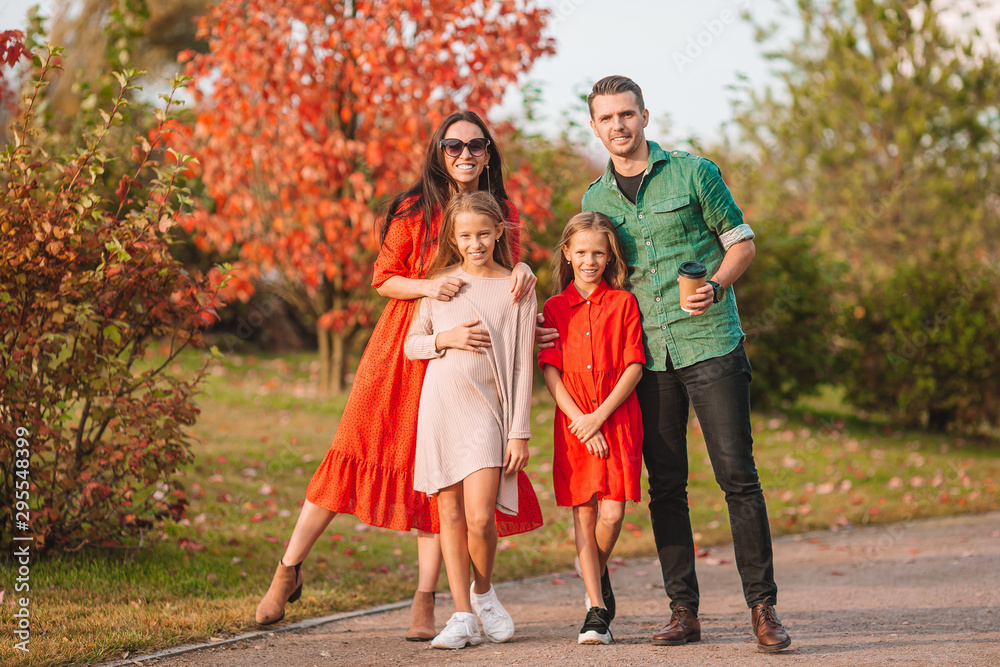 Fototapeta premium Portrait of happy family of four in autumn