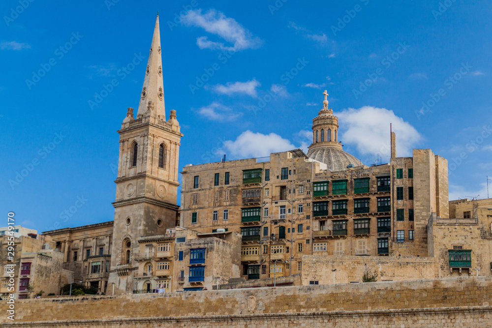 Tower of St Paul's Pro-Cathedral and the cupola of the Basilica of Our Lady of Mount Carmel in Valletta, Malta