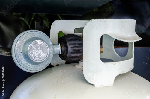 side view of BBQ propane tank and regulator