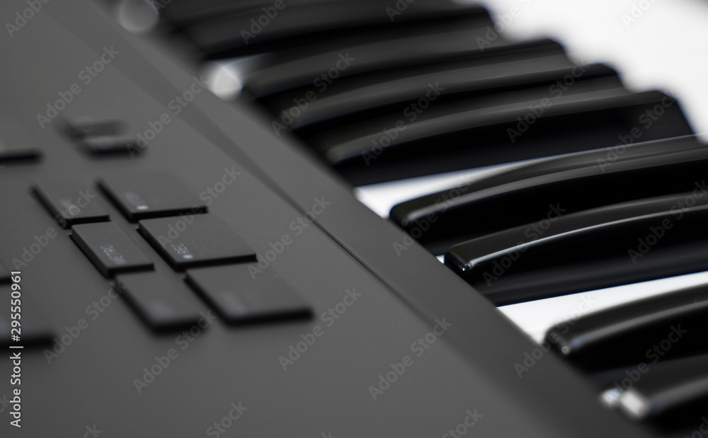 Professional midi keyboard synthesizer with knobs and controllers.