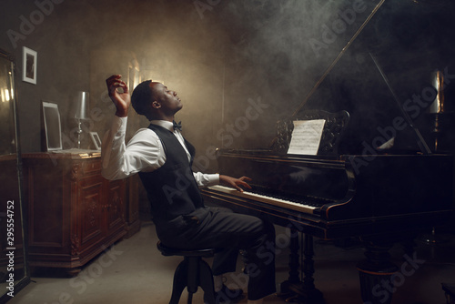 Black grand piano player, jazz performance photo
