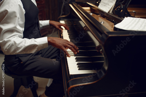Ebony pianist, jazz performer on the stage photo