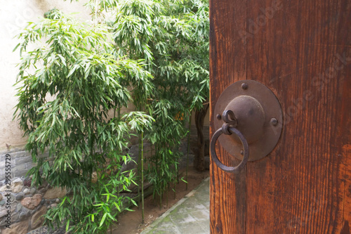 Traditional Chinese Residences interior wooden door and garden in Tianshui Folk Arts Museum Hu Shi folk house, Gansu China photo