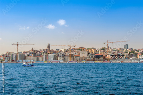 Istanbul, Turkey, 29 June 2019: Karakoy Galata Port, Galata Tower and city ​​lines ships. © Kayihan