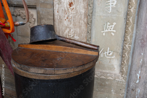 Chinese ancient traditional vat and ladle in front of a temple in Tianshui Wushan, Gansu China photo