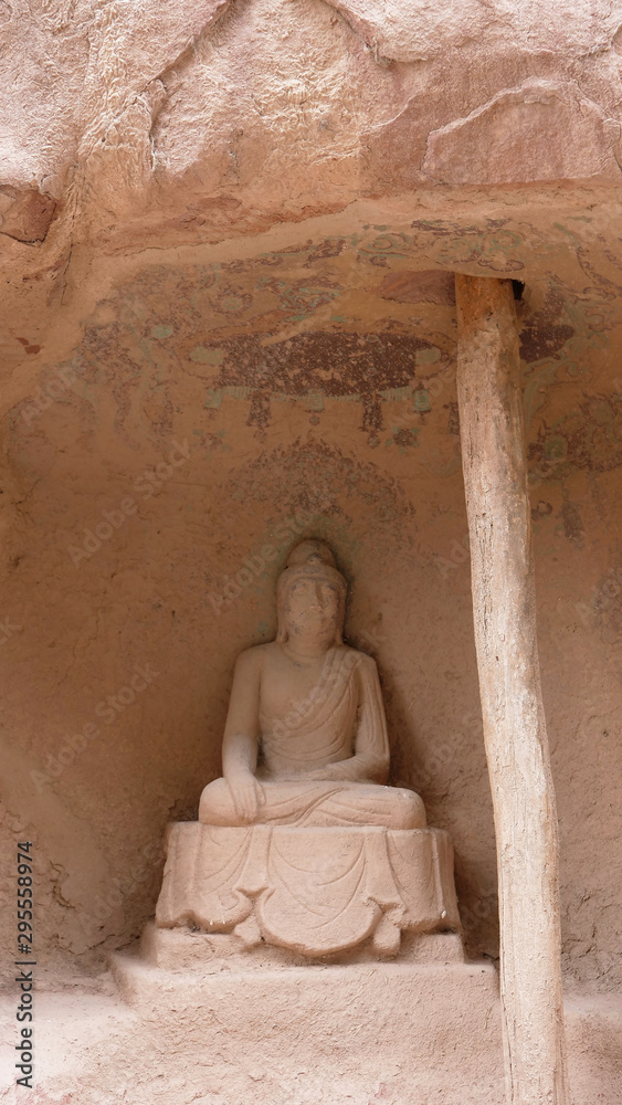 Fototapeta Buddhist grottoes sculpture in Bingling Temple Lanzhou Gansu, China. UNESCO World Heritage Site.