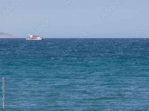 ship travelling in the immensity of the sea © Charly