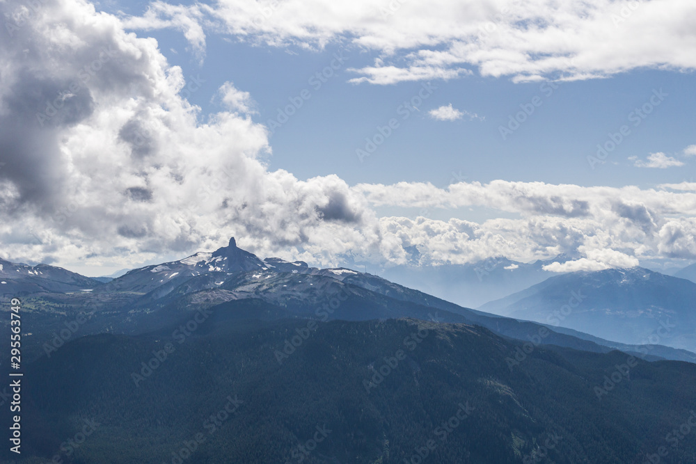 blackcomb mountain peak panorama view cloudy sky summer time.