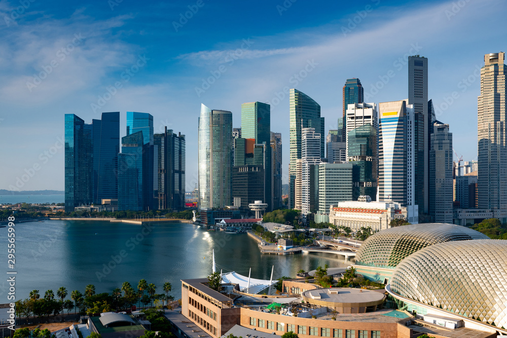 Fototapeta premium Singapore business office building district in day light blue sky.