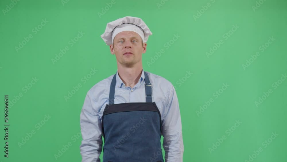 Kung Fu Adult Man Cook Fighting With The Dark Spirit Of The Kitchen. Studio Isolated Shot Against Green Screen Background Kung Fu Adult Man Cook Fighting With The Dark Spirit Of The Kitchen. Studio Isolated Shot Against Green Screen Background