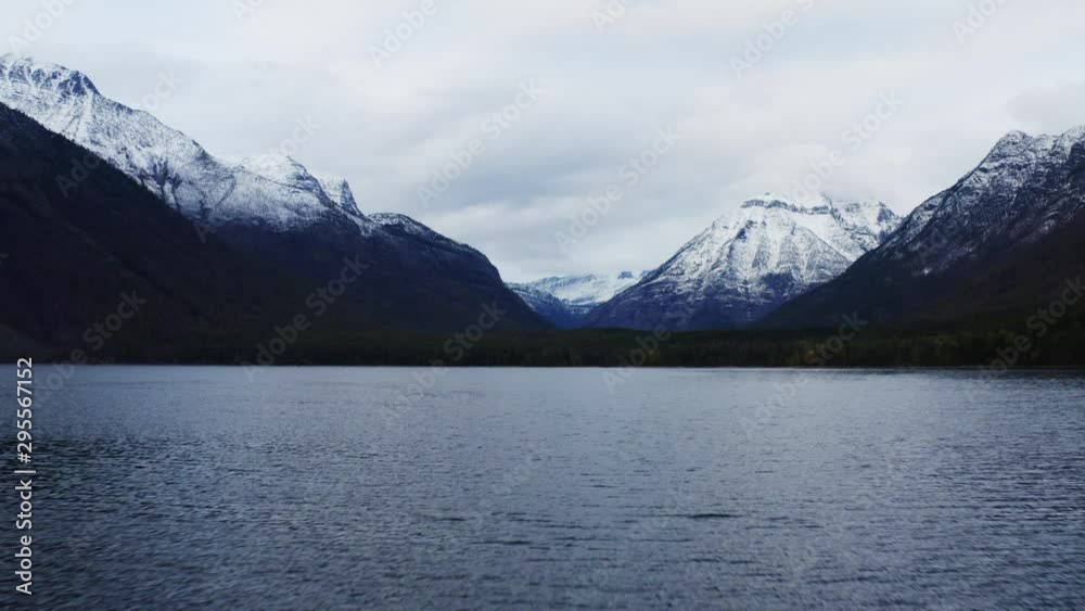 Lake McDonald in Glacier National Park, travel around the United States, beautiful Montana, snowy mountains' tops, breathtaking landscape Lake McDonald in Glacier National Park, travel around the United States, beautiful Montana, snowy mountains' tops, breathtaking landscape