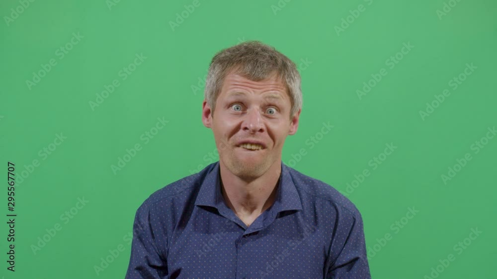 Adult Man Showing The Upper Teeth Like In Front Of The Dentist. Studio Isolated Shot Against Green Screen Background Adult Man Showing The Upper Teeth Like In Front Of The Dentist. Studio Isolated Shot Against Green Screen Background