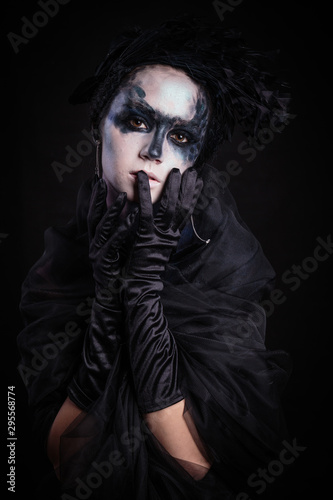 Halloween photo shoot Day of the dead on a black background with in the studio. © ezumer