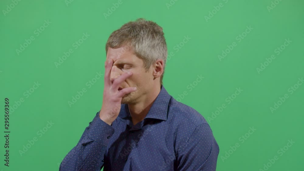 Frustration Demonstrated By An Adult Man. Studio Isolated Shot Against Green Screen Background Frustration Demonstrated By An Adult Man. Studio Isolated Shot Against Green Screen Background
