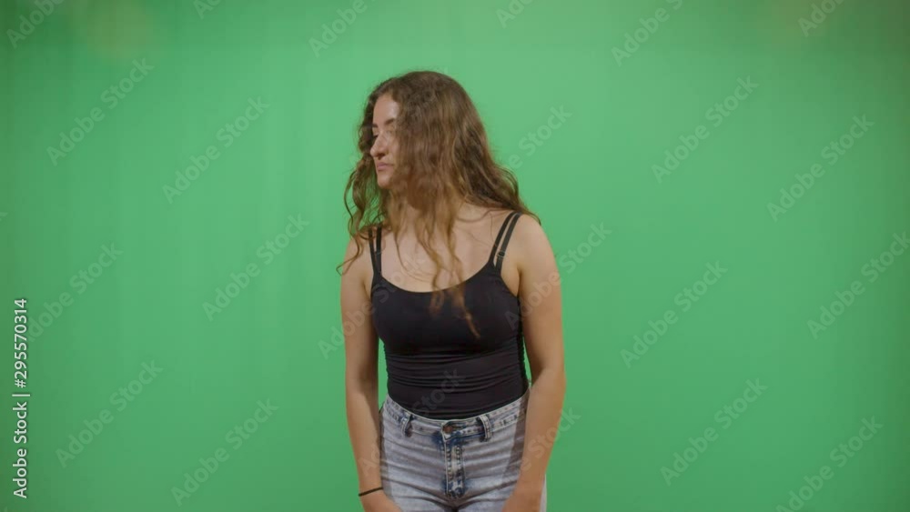 Woman Looking Around For Something Lost. Studio Isolated Shot Against Green Screen Background Woman Looking Around For Something Lost. Studio Isolated Shot Against Green Screen Background