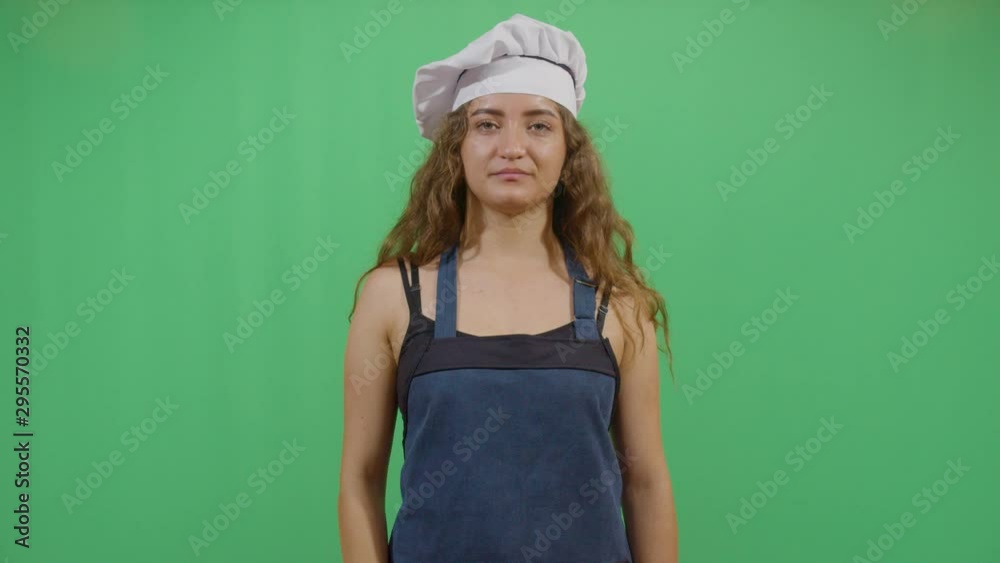 Woman Cook Making A Sign That Something Is Delicious . Studio Isolated Shot Against Green Screen Background Woman Cook Making A Sign That Something Is Delicious . Studio Isolated Shot Against Green Screen Background
