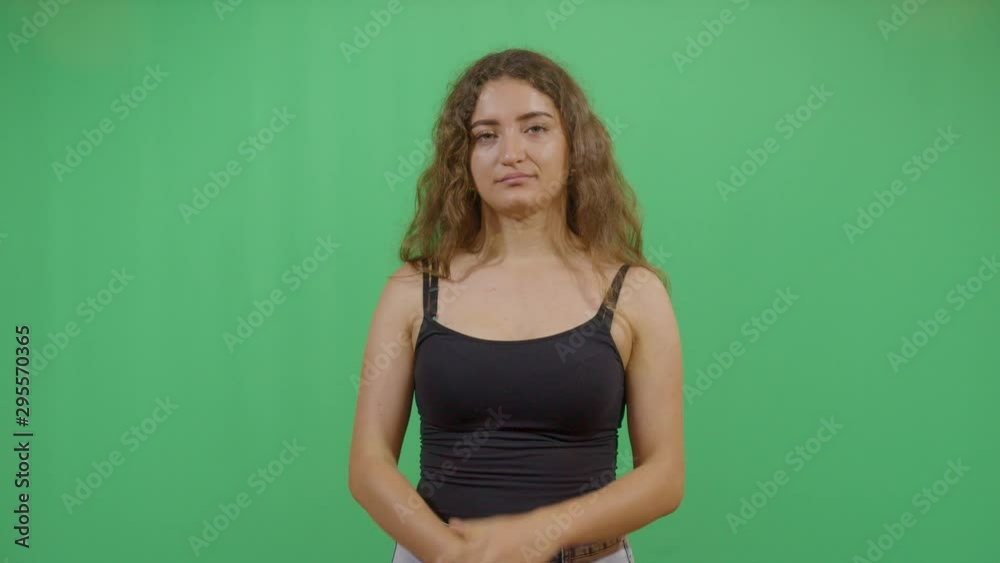 Woman Clapping Slowly Disappointed And Unimpressed. Studio Isolated Shot Against Green Screen Background Woman Clapping Slowly Disappointed And Unimpressed. Studio Isolated Shot Against Green Screen Background