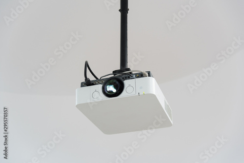 Close-up of white projector hanging from the roof