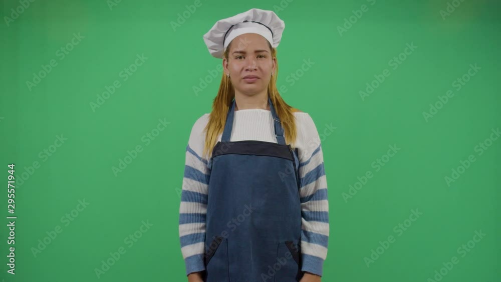 Cook Mouth Cleanning With The Apron. Studio Isolated Shot Against Green Screen Background Cook Mouth Cleanning With The Apron. Studio Isolated Shot Against Green Screen Background