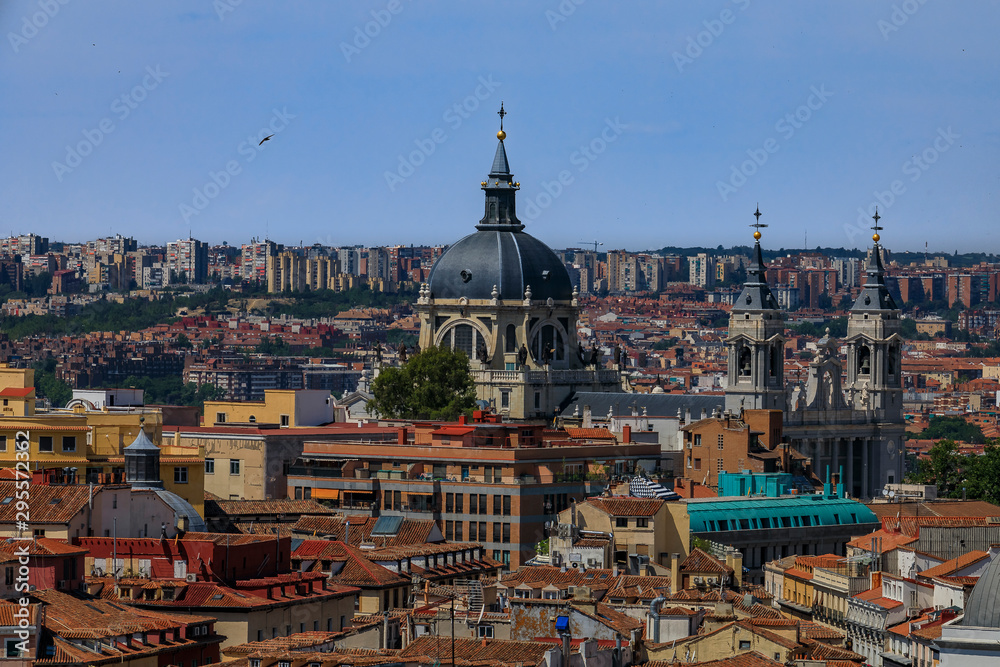 Fototapeta premium Aerial view of the Madrid cityscape with Almudena Cathedral rooftops in the city center in Madrid, Spain